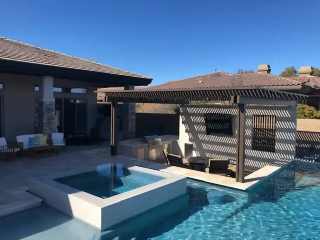 Patio and outdoor living by Edgewater Custom Pools – TV Wall Patio Kitchen BBQ