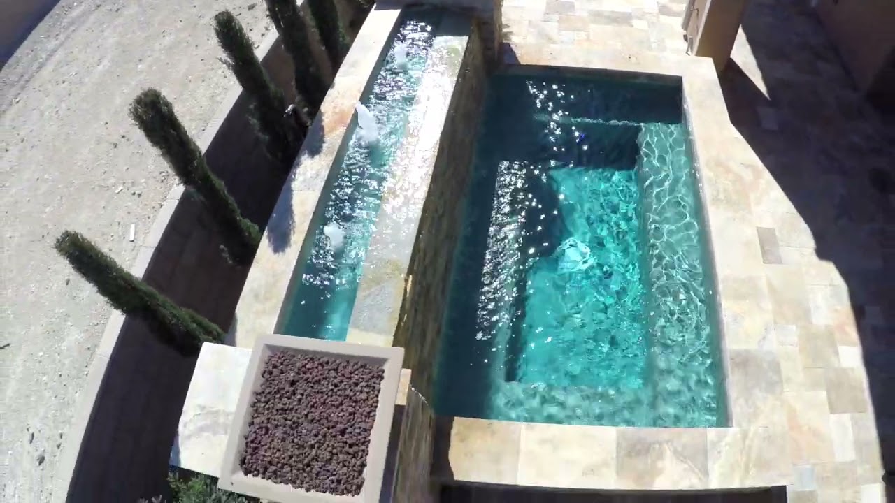 Heated spa with fire features extending the swim season at a Las Vegas home