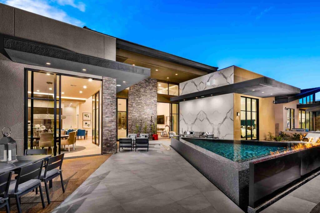 Custom pool by Edgewater Custom Pools – Peak @ Mesa Ridge Boulder Desert Contemporary Rear Elevation