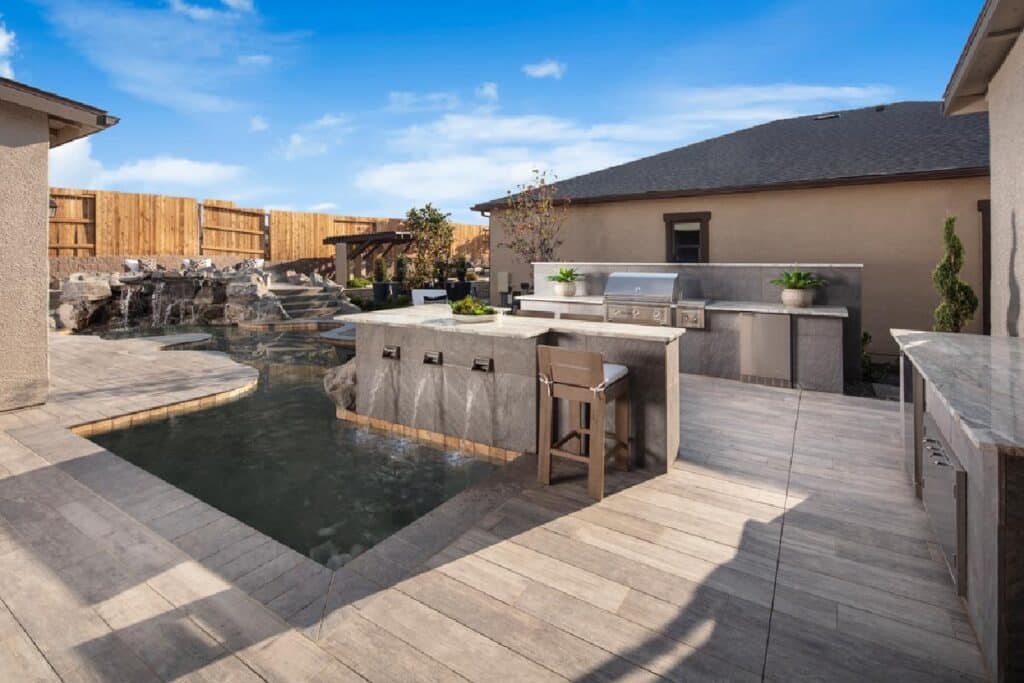 Custom pool by Edgewater Custom Pools – Regency At Caramella Ranch Glenwood Collection Yardley Backyard