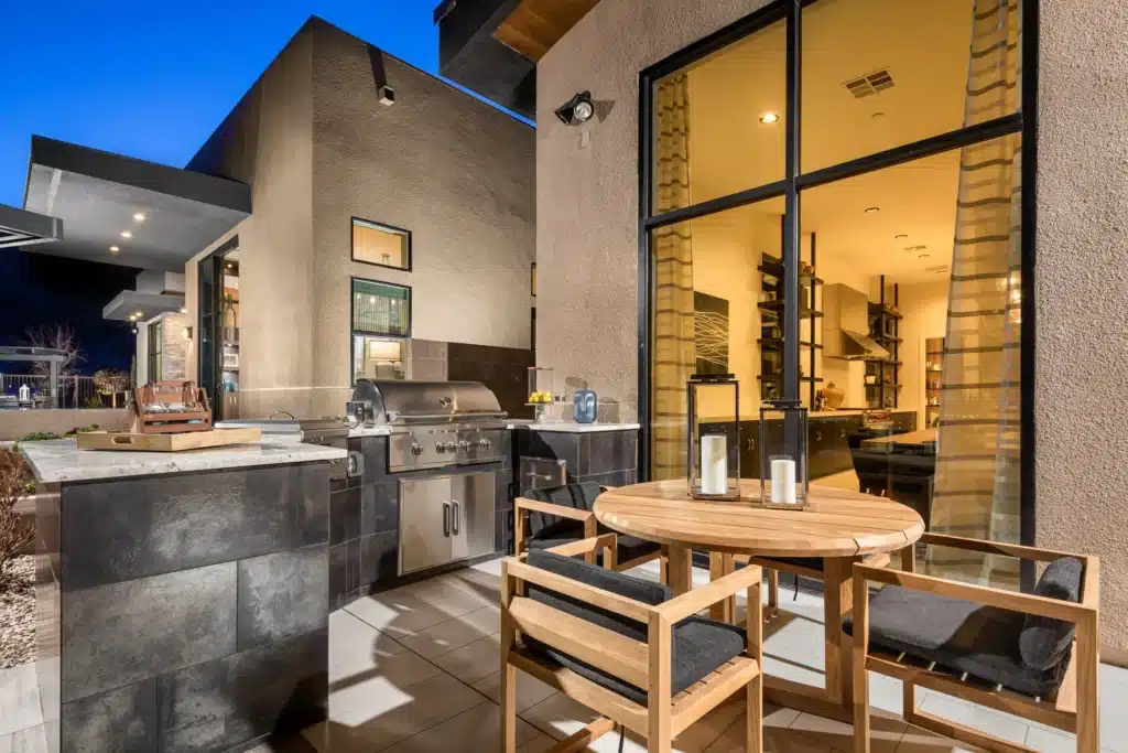 Outdoor living by Edgewater Custom Pools &ndash; Peak Cascade Modern Built In BBQ Twilight